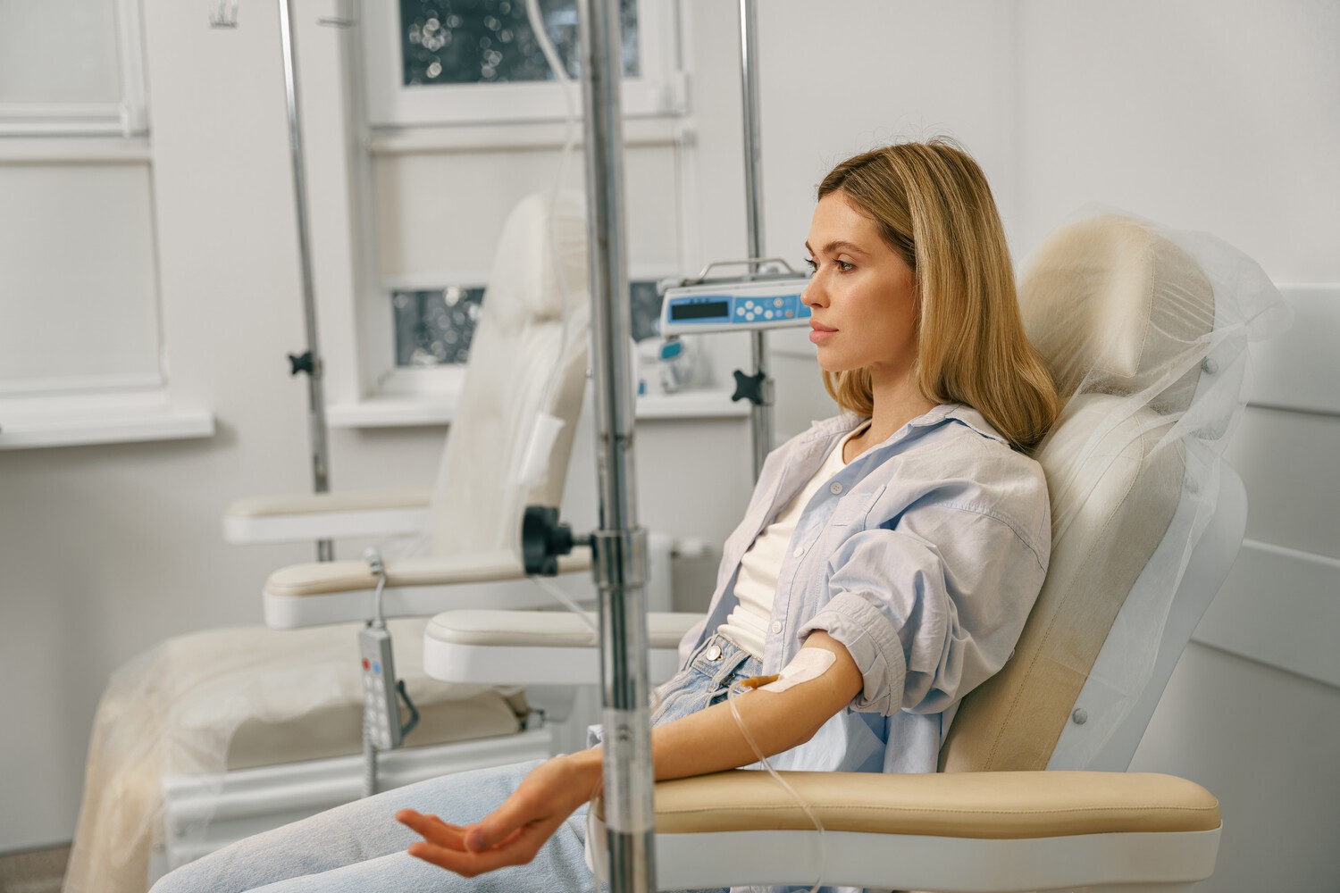Woman,Sitting,In,Armchair,While,Receiving,Iv,Infusion,In,Hospital.